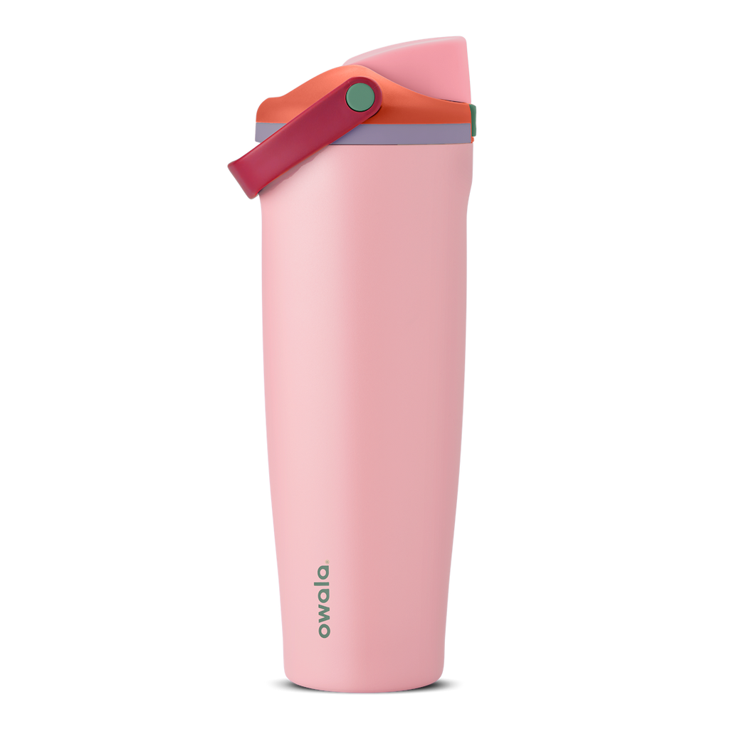 FreeSip Sway 40oz in Sugar High, soft pink insulated water bottle with red-orange flip cap, deep magenta carry loop, lavender lid accent ring and green push-button, lid open