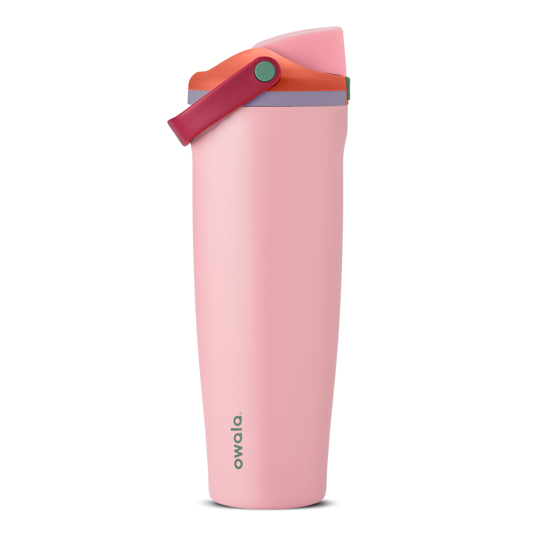 FreeSip Sway 40oz in Sugar High, soft pink insulated water bottle with red-orange flip cap, deep magenta carry loop, lavender lid accent ring and green push-button, lid open