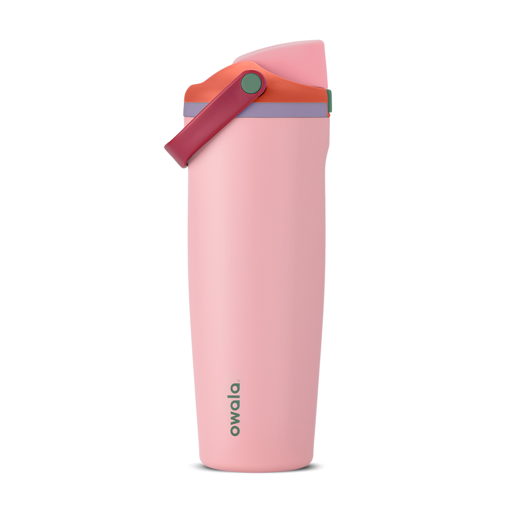 FreeSip Sway 30oz in Sugar High, soft pink insulated water bottle with red-orange flip cap, deep magenta carry loop, lavender lid accent ring and green push-button, lid open
